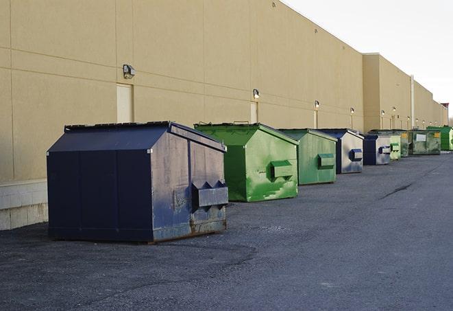 an aerial view of construction dumpsters placed on a large lot in Corning